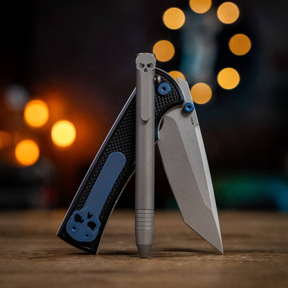 Chaves pens in gray with a sleek design next to a black knife featuring blue accents