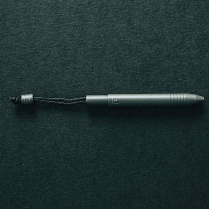 Big Idea Design LLC sleek EDC titanium mini pen with durable body and attached lanyard