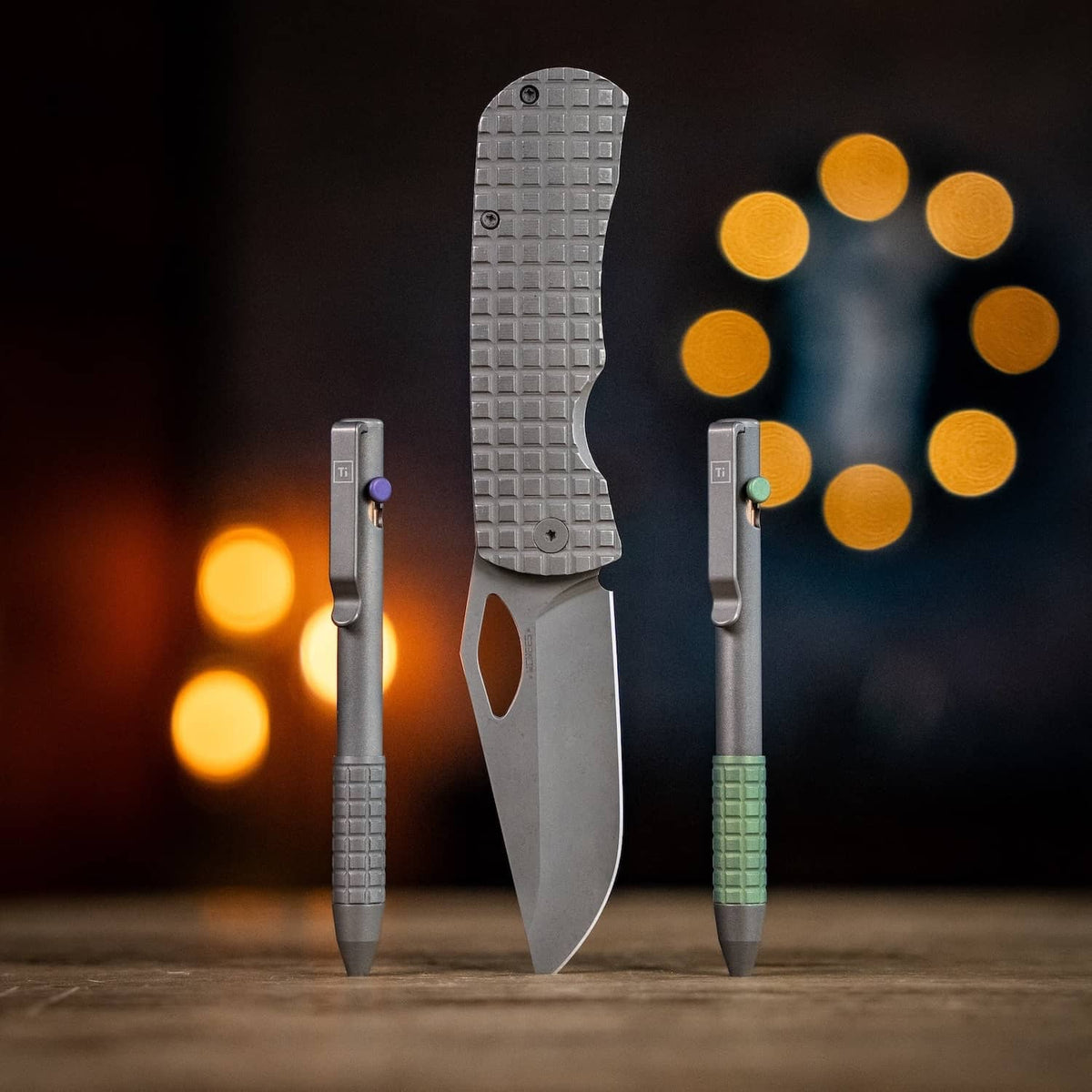 McNeese Pen in Graphite with Textured Grip, Featured alongside a Gray Folding Knife