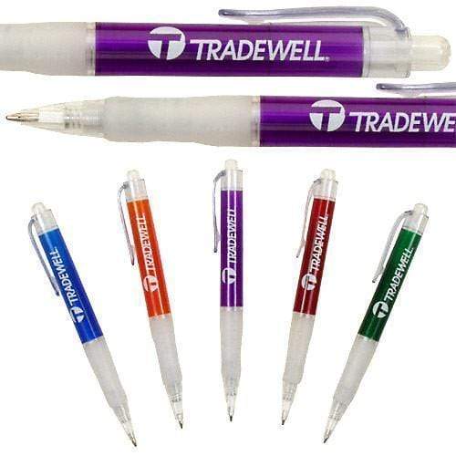 The Xpress Montero pens by PensXpress are customizable retractable pens in blue, orange, purple, red, and green with translucent barrels and clips. Each promotional pen displays the TRADEWELL logo in white letters.